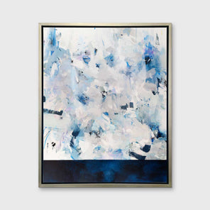 A blue, white and light grey abstract print in a silver floater frame hangs vertically on a white wall.