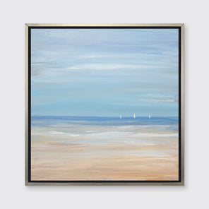 A blue, beige and white abstract seascape print with three small sailboats in a silver floater frame hangs on a white wall.