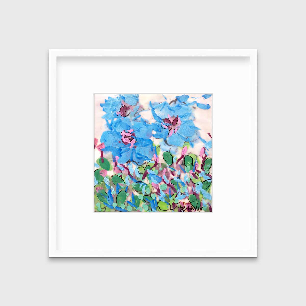 A blue, pink, green and white abstract floral print in a white frame with a mat hangs on a white wall.
