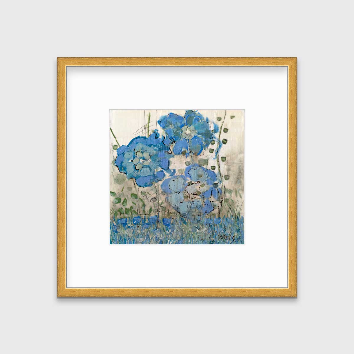 A blue floral print in a gold frame with a mat hangs on a white wall.