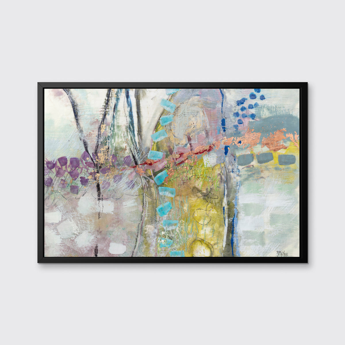 A multicolored abstract print in a black floater frame hangs on a white wall.
