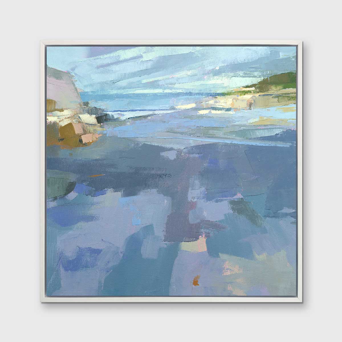 A blue, purple and green abstract landscape print in a white floater frame hangs on a white wall.