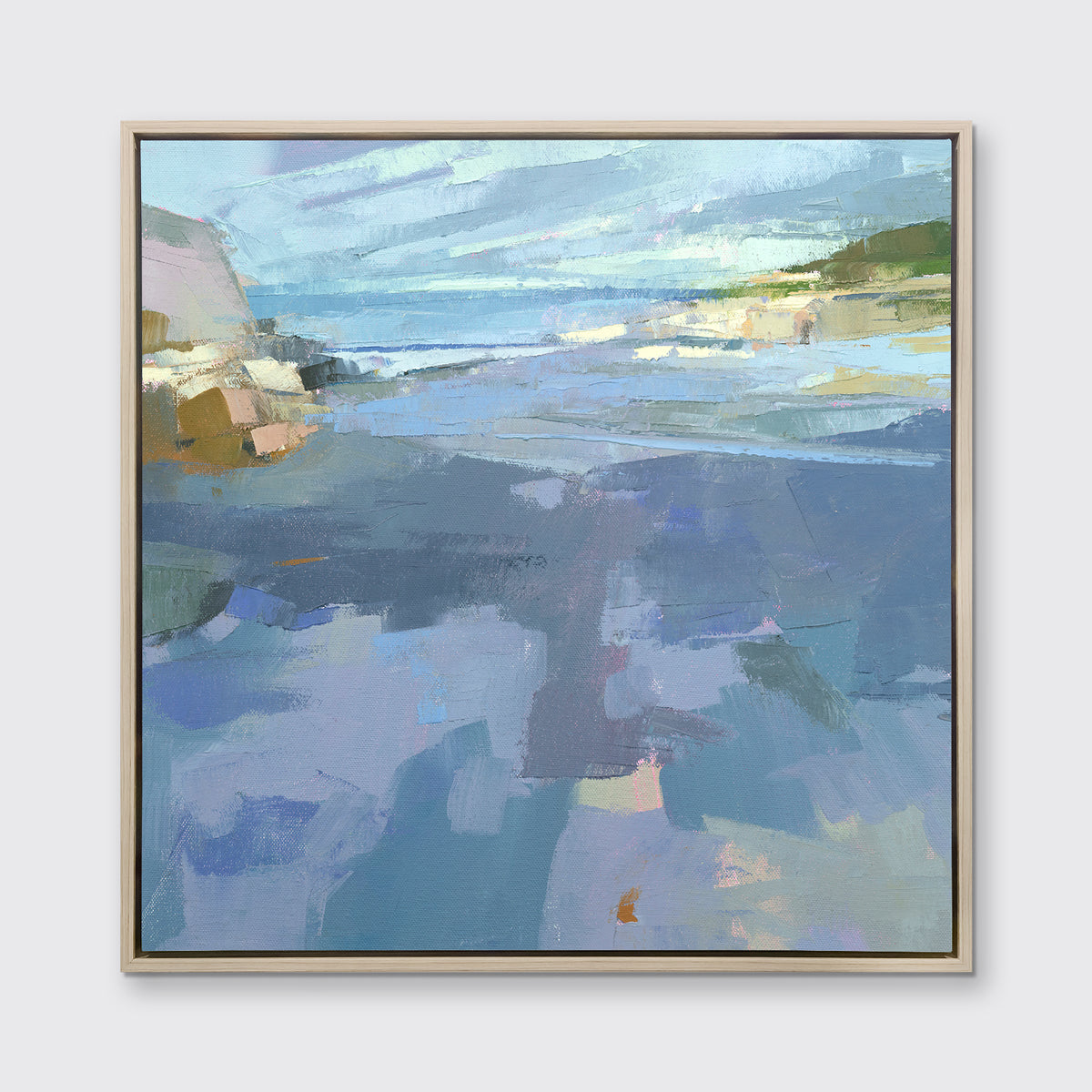 A blue, purple and green abstract landscape print in a white oak wood floater frame hangs on a white wall.