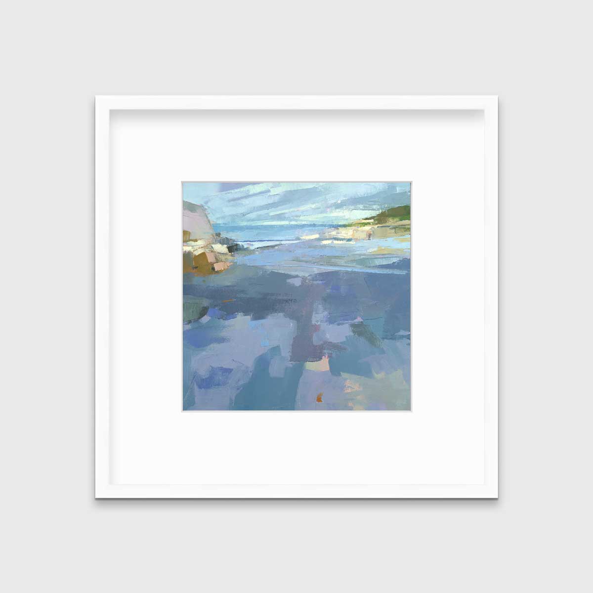 A blue, purple and green abstract landscape print in a white frame with a mat hangs on a white wall.