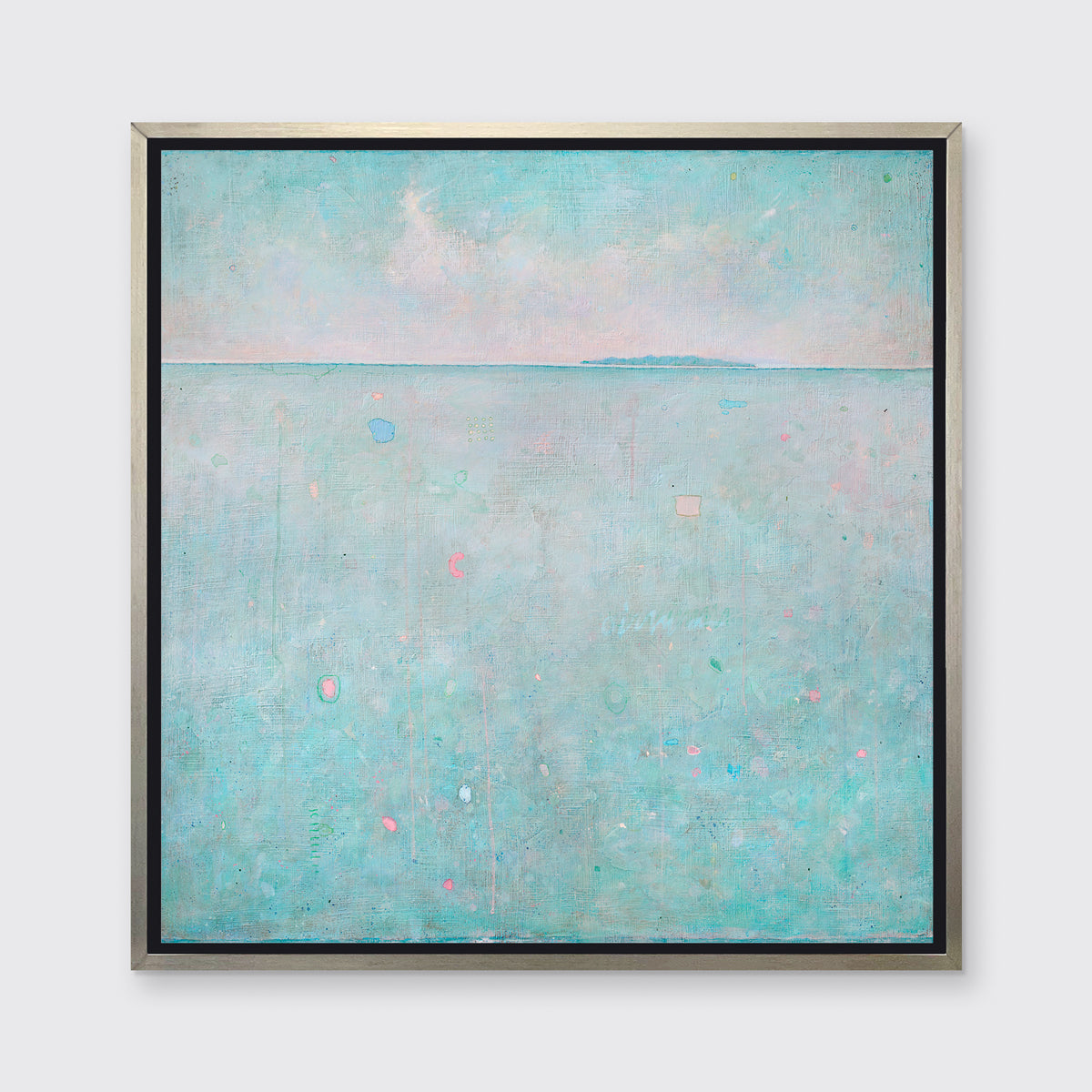 A light blue abstract landscape print in a silver floater frame hangs on a white wall.