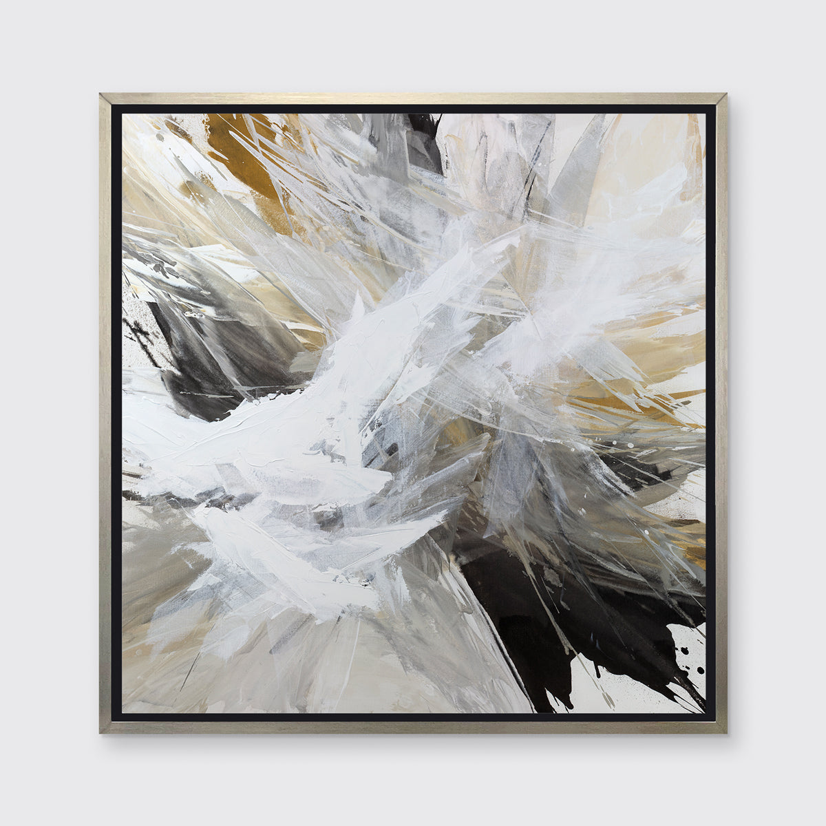 A white, black, grey and gold abstract print in a silver floater frame hangs on a white wall.