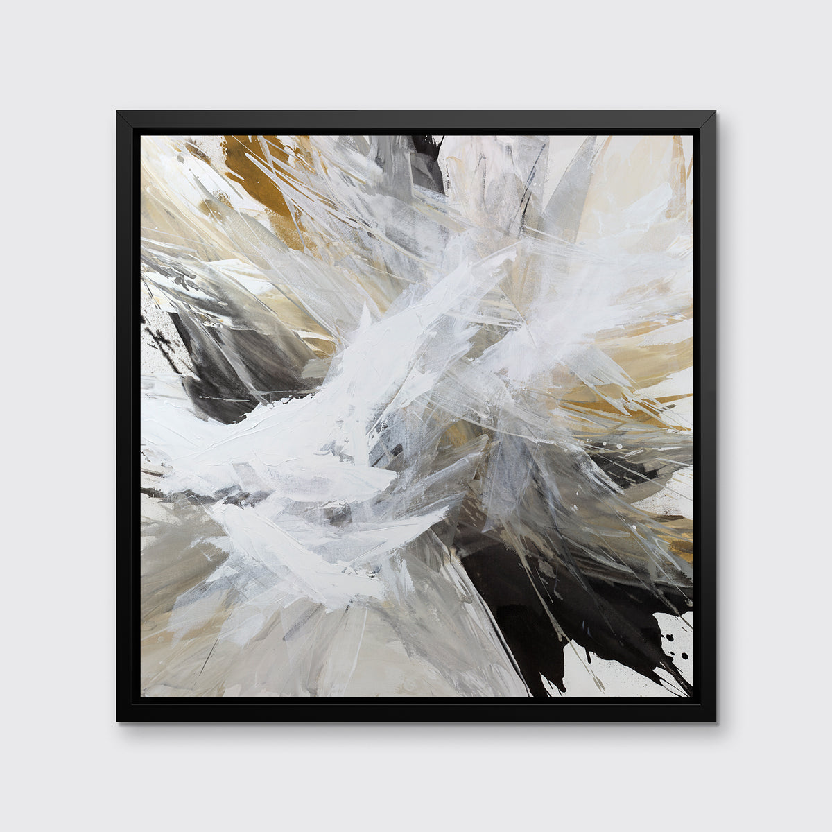 A white, black, grey and gold abstract print in a black floater frame hangs on a white wall.