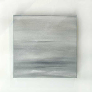 A tonal grey abstract painting by Tony Iadicicco hangs on a white wall.