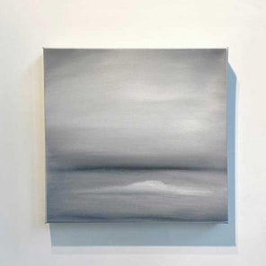 A tonal grey abstract painting by Tony Iadicicco hangs on a white wall.