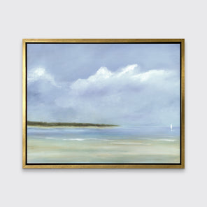 A blue, white and green seascape print in a gold floater frame hangs on a white wall.