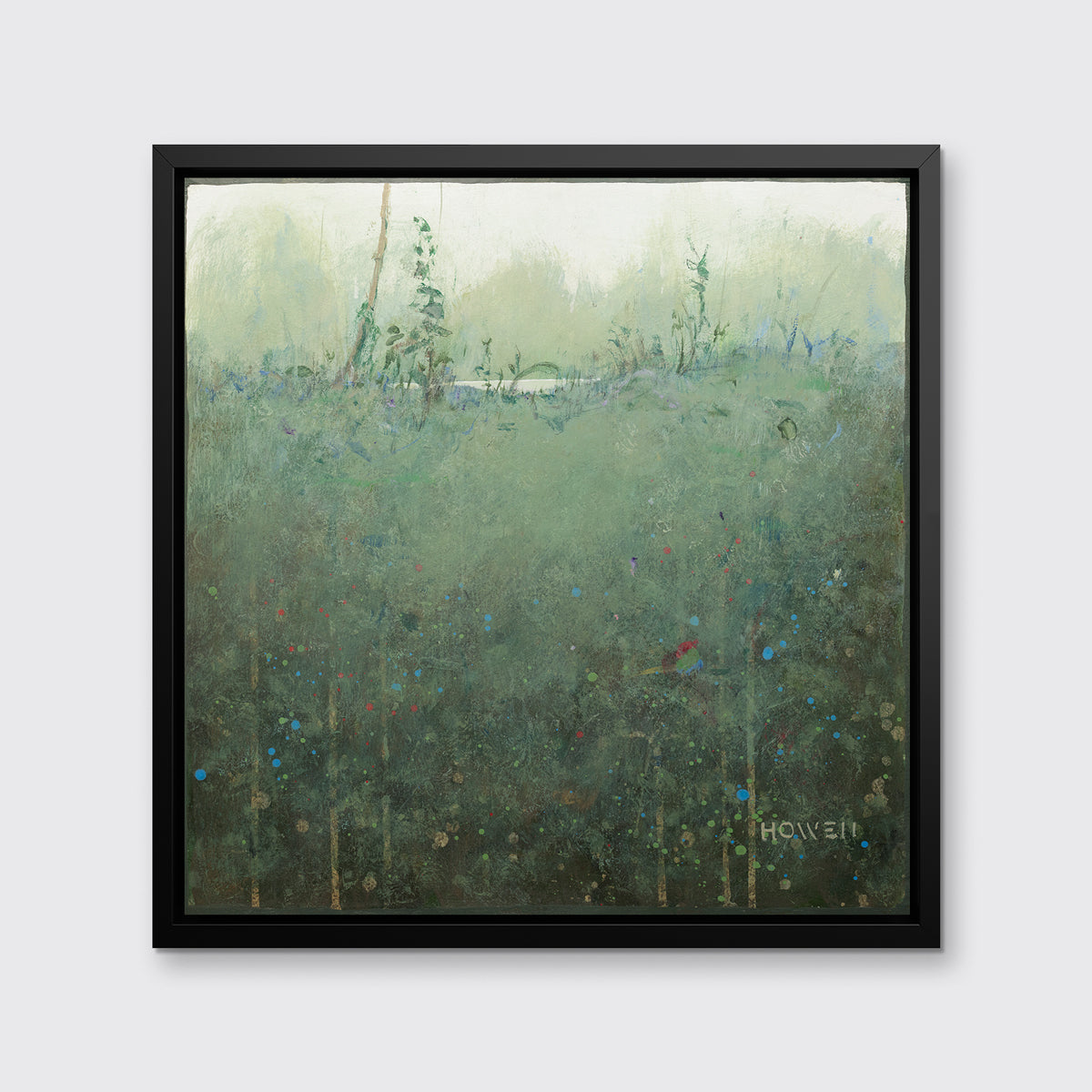 A dark muted green abstract landscape print in a black floater frame hangs on a white wall.