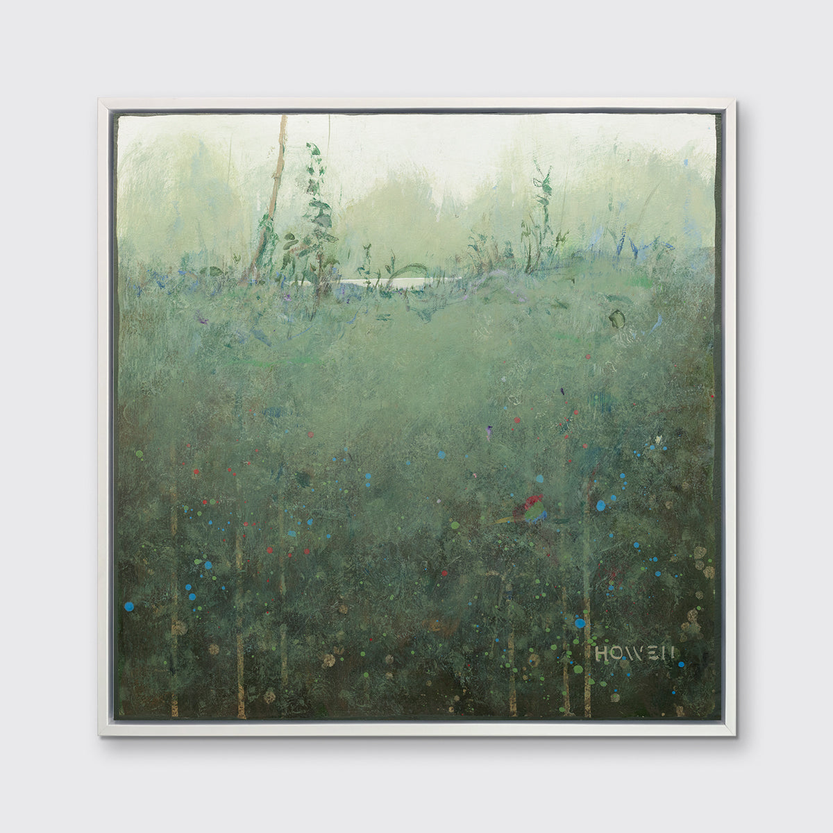 A dark muted green abstract landscape print in a white floater frame hangs on a white wall.