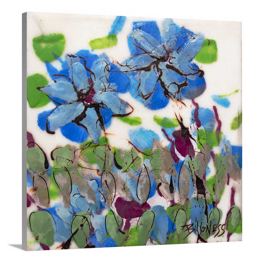 A side-angle view of a blue, green and white abstract floral print on canvas.