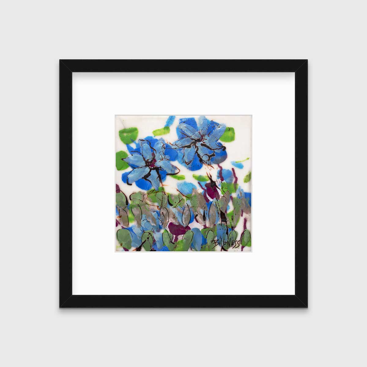 A blue, green and white abstract floral print in a black frame with a mat hangs on a white wall.