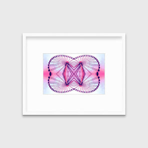 An abstract print of a kaleidoscopic ferris wheel with pink and purple tones in a white frame with a mat hangs on a white wall.