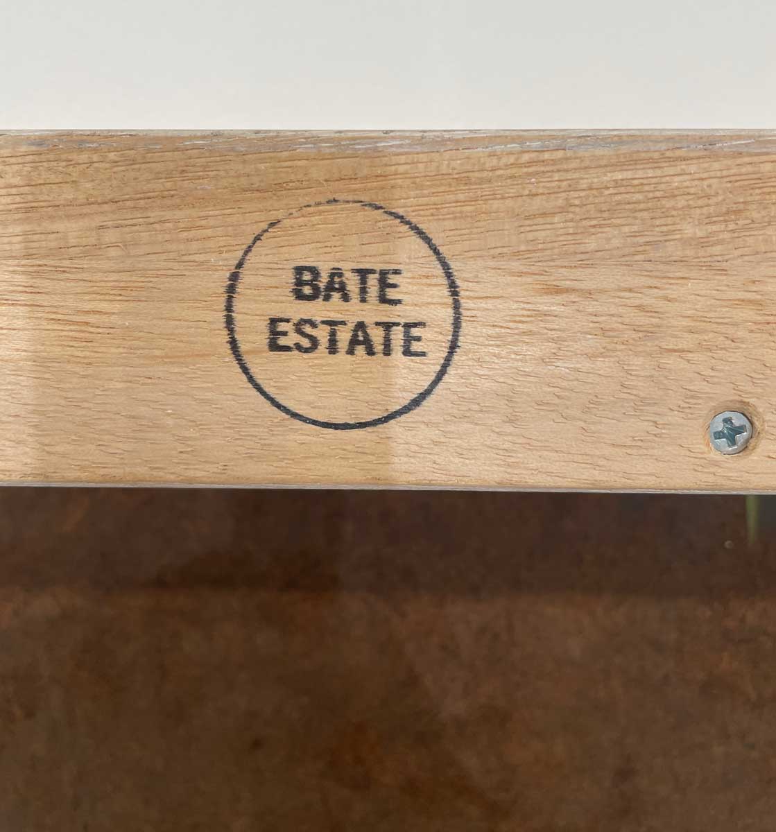 Photo of the Bate Estate stamp on the frame of one of Stanley Bate's paintings.