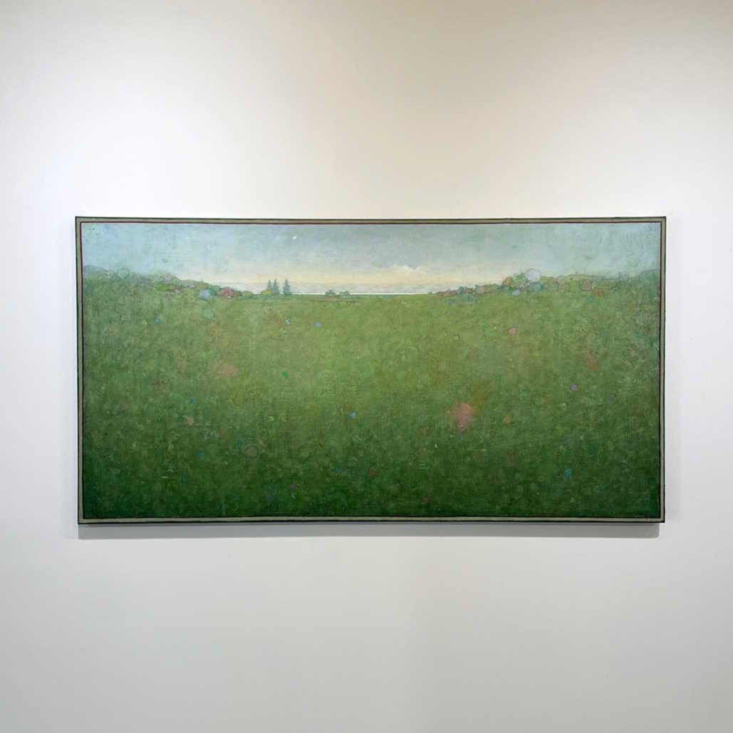 A green and blue abstract landscape painting by Elwood Howell hangs on a white wall.