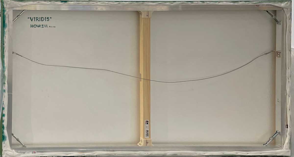 The back of the painting, with the title and artist's name and wire for hanging.