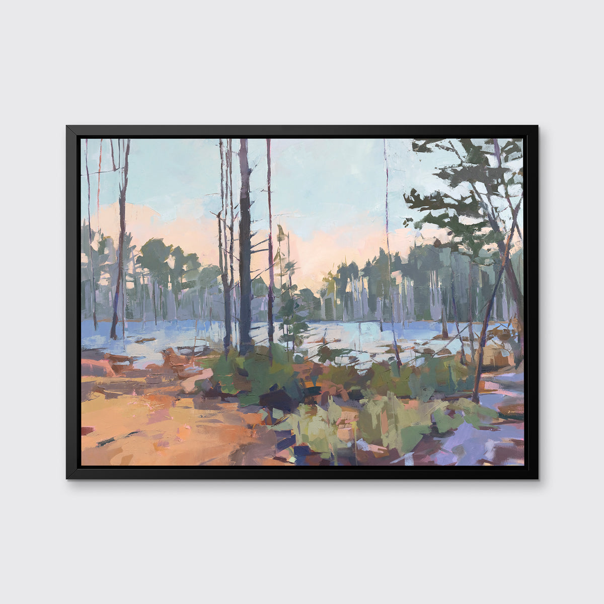 A light blue, green, brown and purple abstract landscape print in a black floater frame hangs on a white wall.