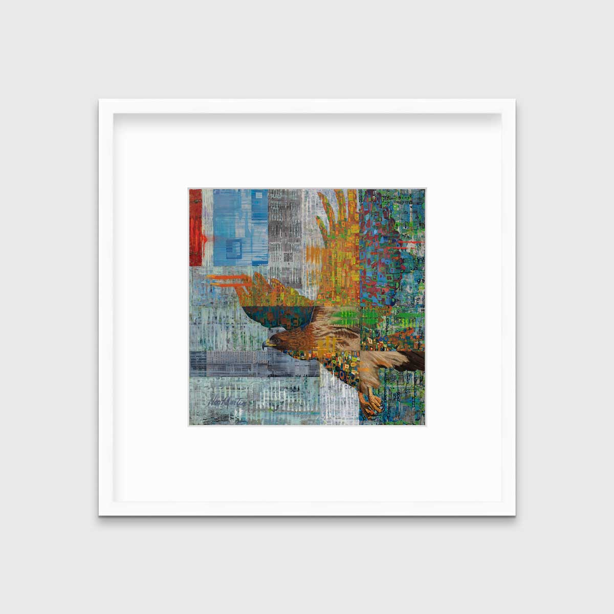 A multicolored abstract print of a flying eagle in a white frame with a mat hangs on a white wall.