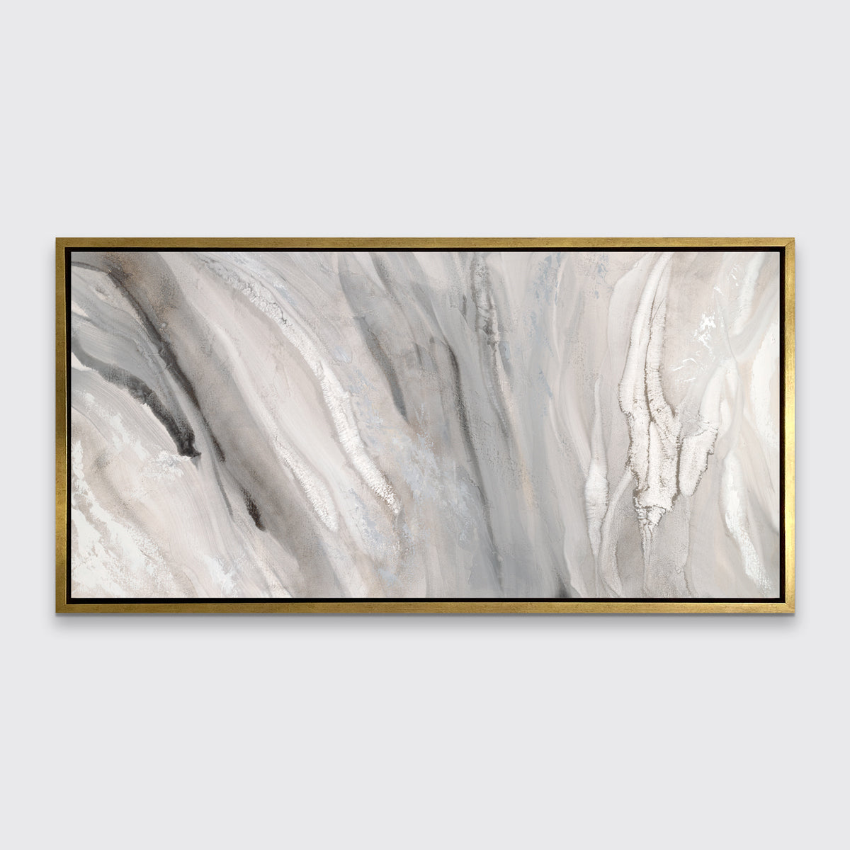 A beige, white and gold abstract print in a gold floater frame hangs on a white wall.