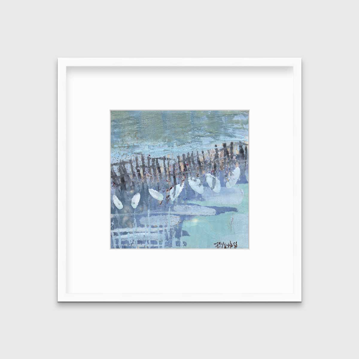 A blue, lavender and olive green abstract print in a white frame with a mat hangs on a white wall.