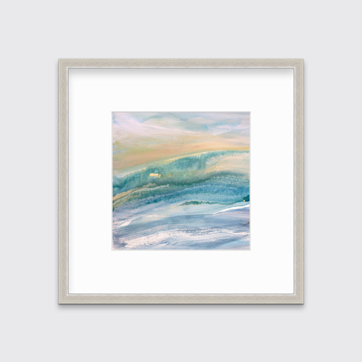 A blue, teal, yellow and white abstract print in a silver frame with a mat hangs on a white wall.