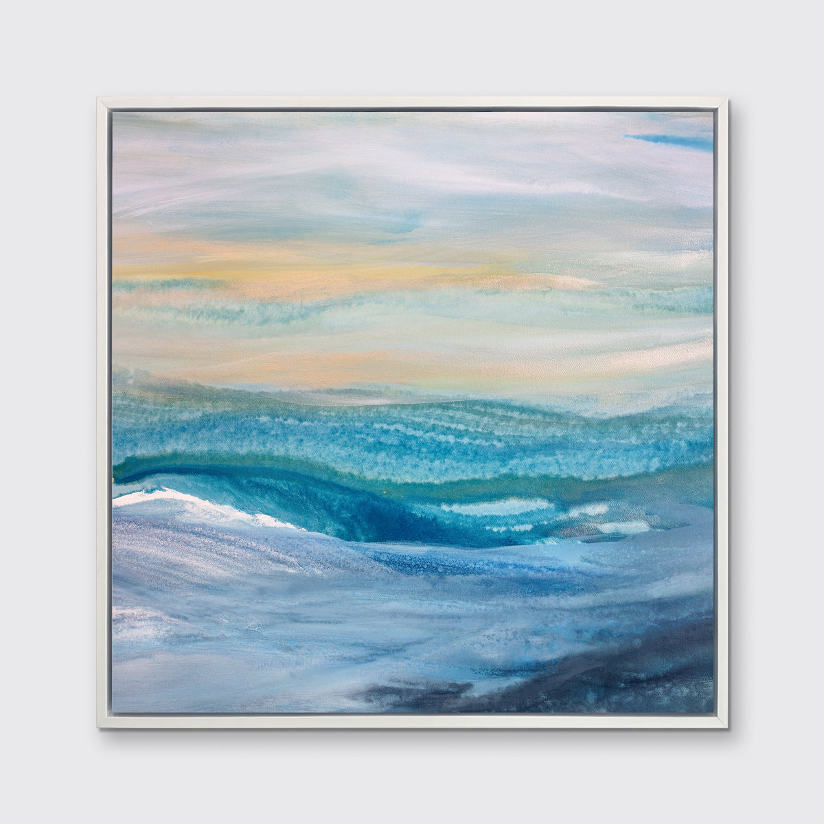 A blue, teal, yellow and white abstract print in a white floater frame hangs on a white wall.