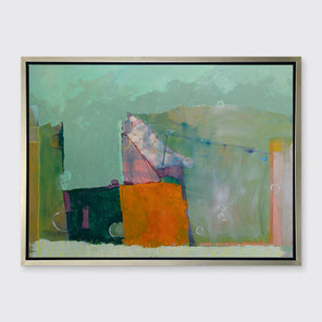 A green, orange and purple abstract print in a silver floater frame hangs on a white wall.