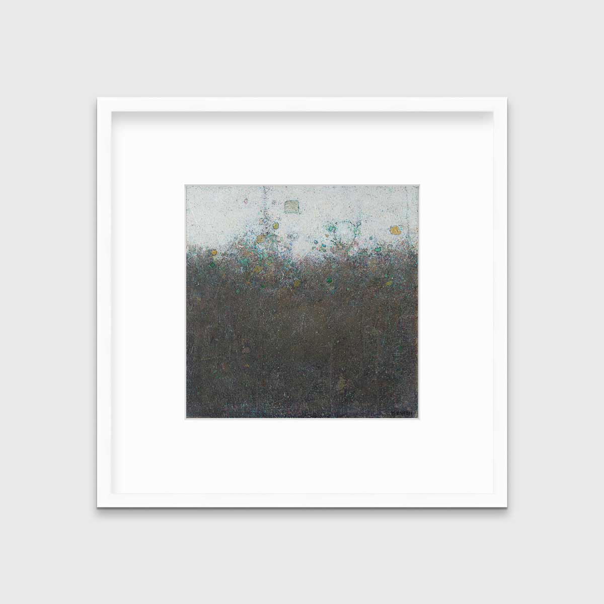 A dark olive green abstract landscape print in a white frame with a mat hangs on a white wall.