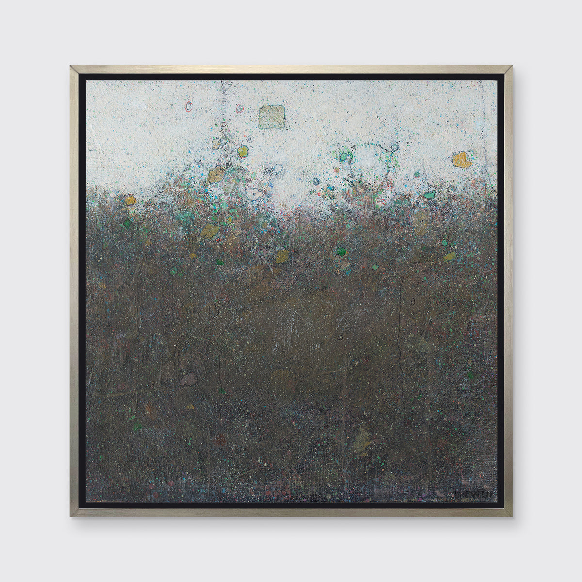 A dark olive green abstract landscape print in a silver floater frame hangs on a white wall.