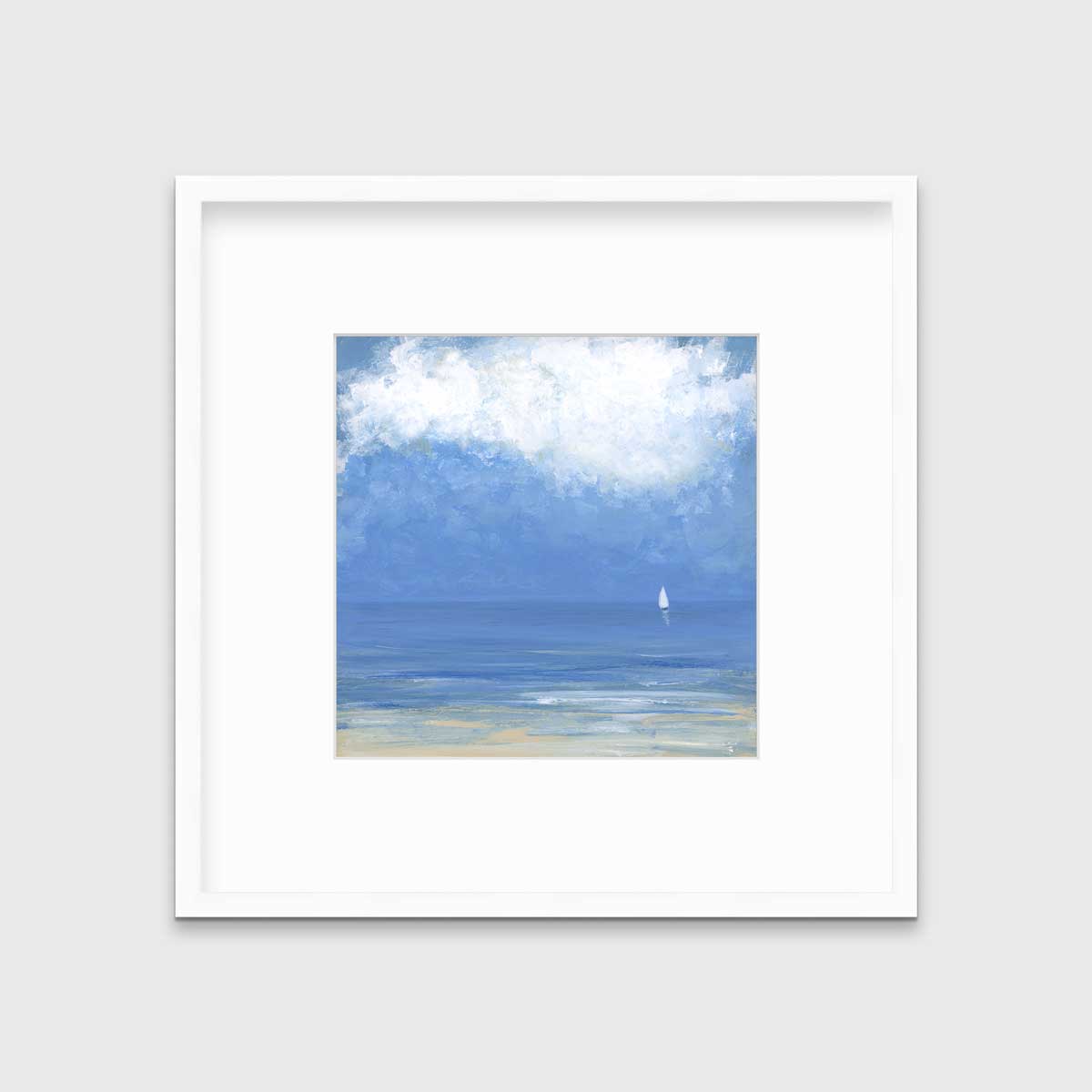 A blue, beige and white abstract seascape print with a small sailboat in a white frame with a mat hangs on a white wall.