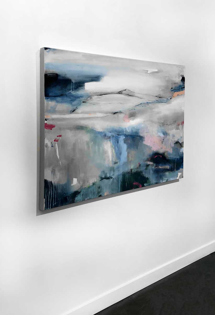 A left side-angle view of an abstract painting by Kelly Rossetti hangs on a white wall.