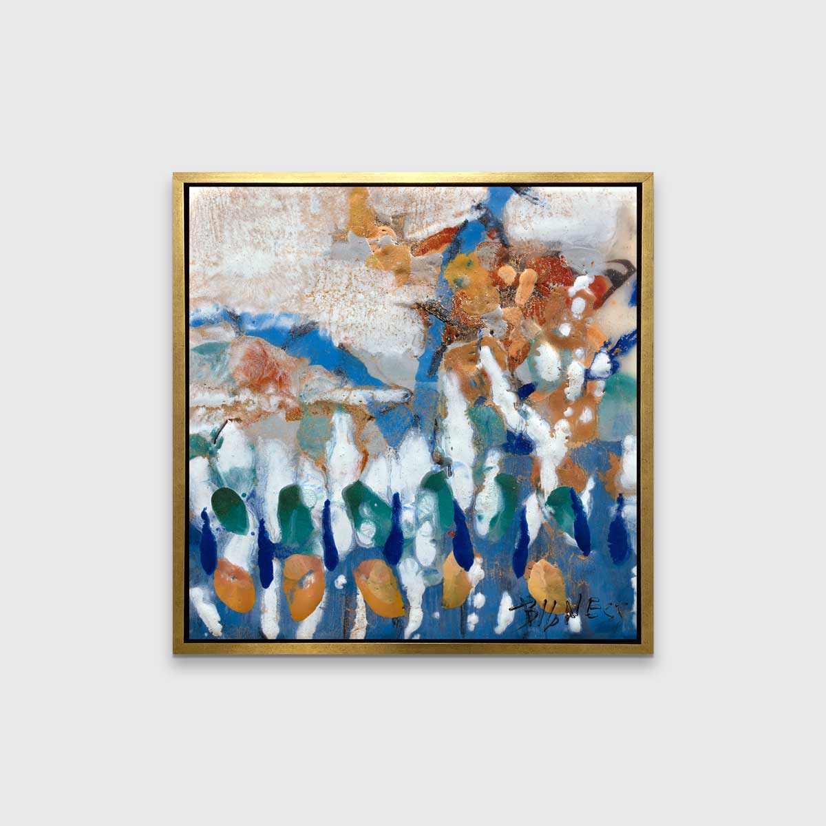 A multicolored abstract print in a gold floater frame hangs on a white wall.