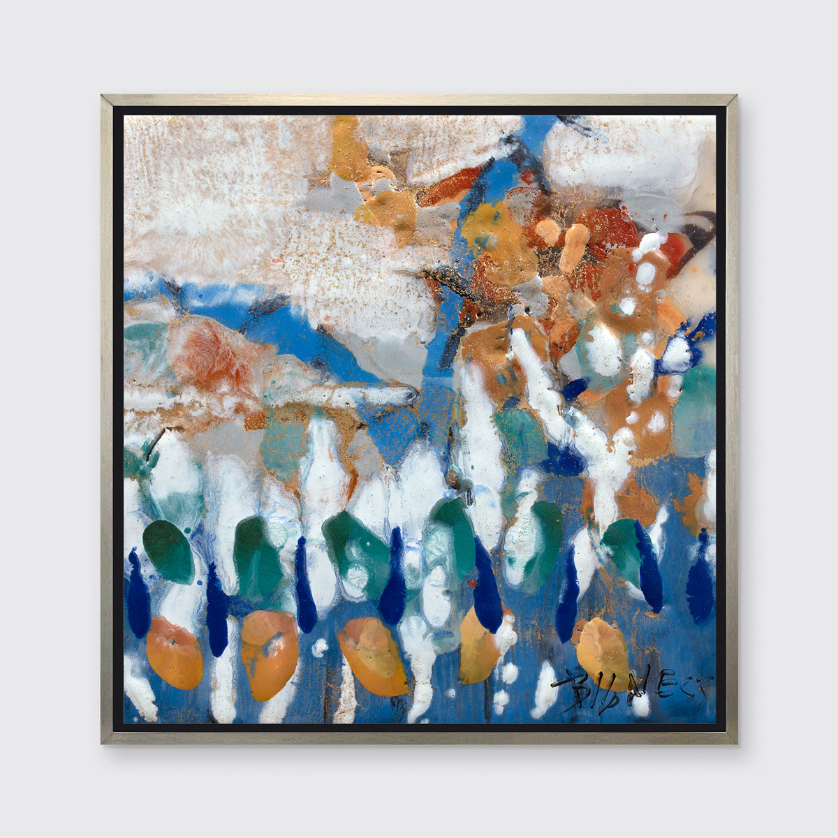 A multicolored abstract print in a silver floater frame hangs on a white wall.