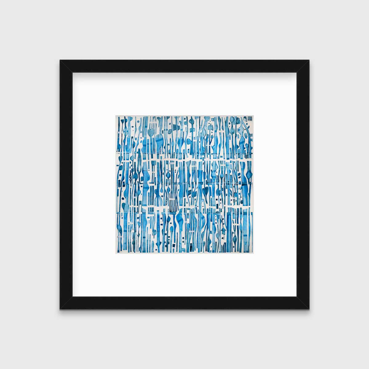 A blue and white abstract print in a black frame with a mat hangs on a white wall.