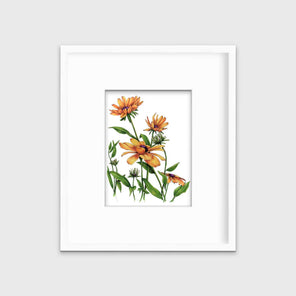 Yellow and orange flowers with a purple center and green stems and leaves print in a white frame with a mat hangs on a white wall.