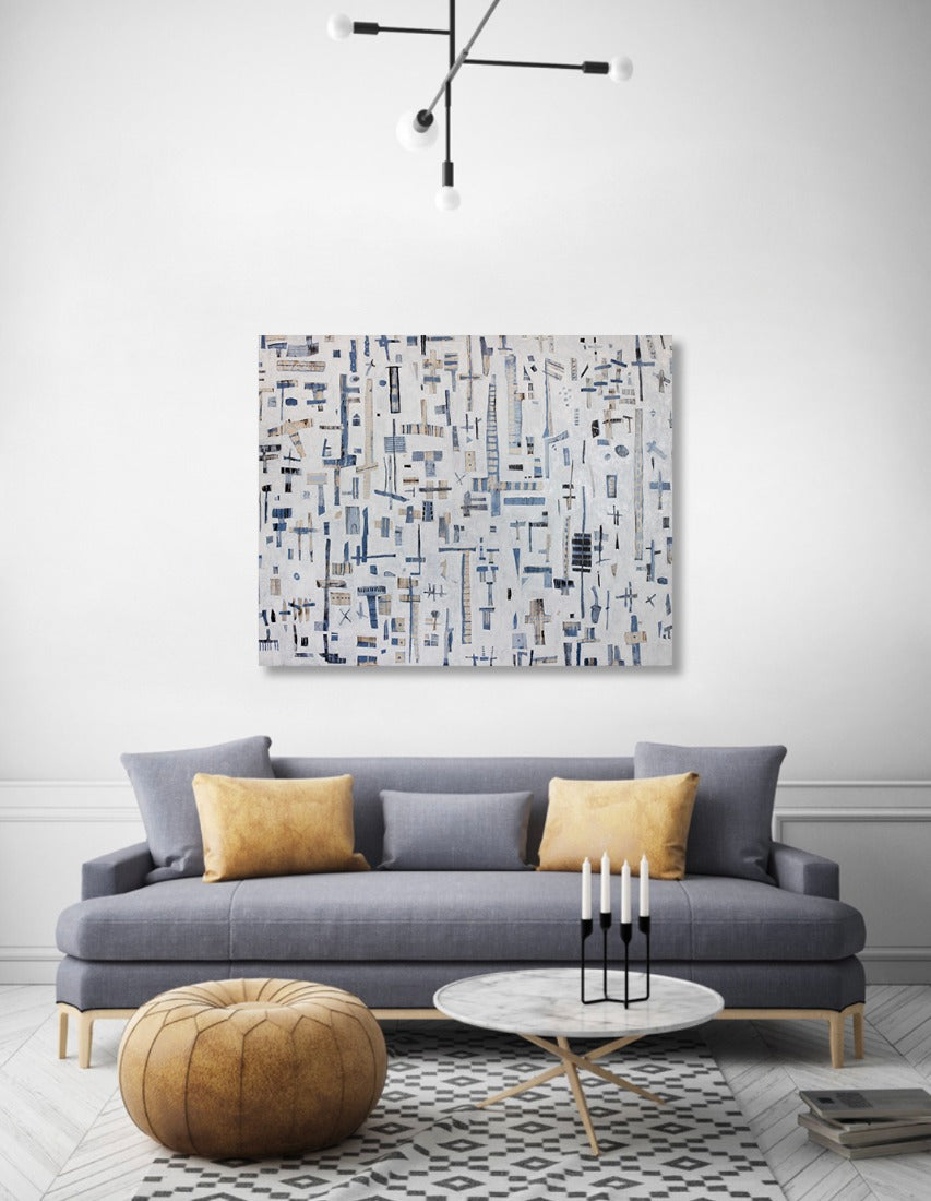 Flight to Nowhere painting hanging on a white wall above a grey couch with yellow pillows. 
