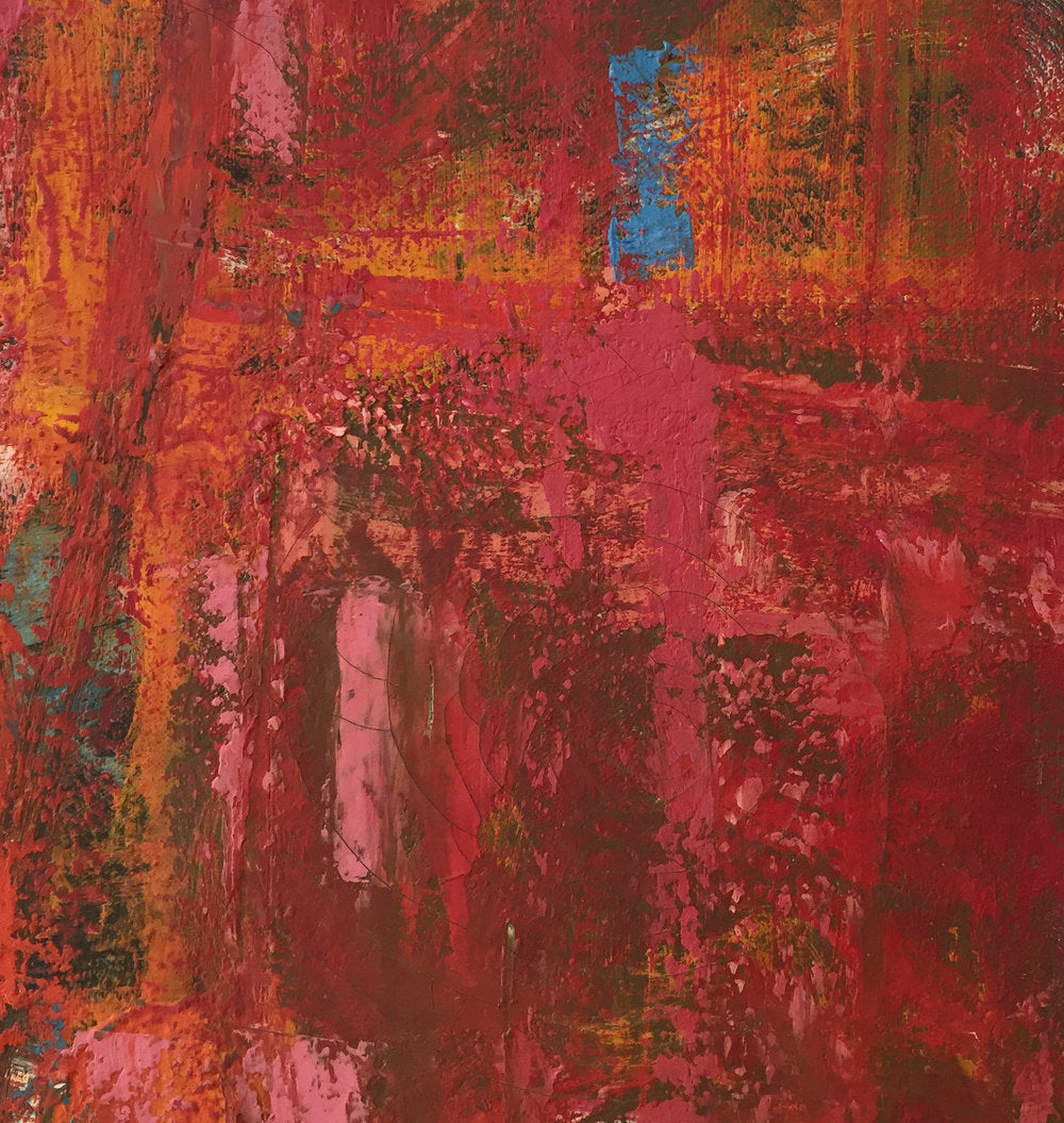 Detail of abstract painting with layers of red, pink, orange, and blue paint.
