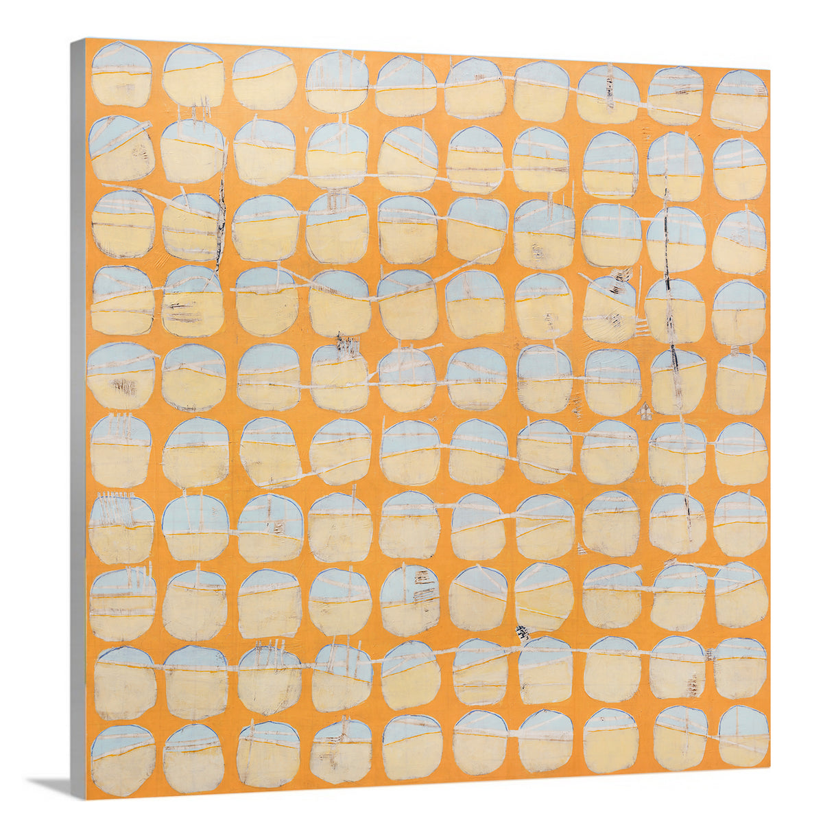 A side-angle view of an orange and light blue abstract circle print on canvas.