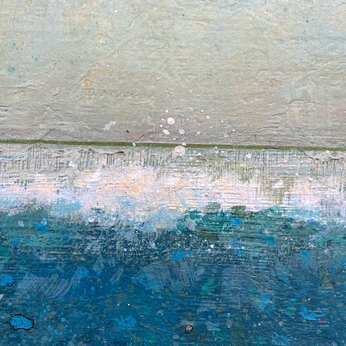 A up close detail view of a blue, white and beige part of the painting.