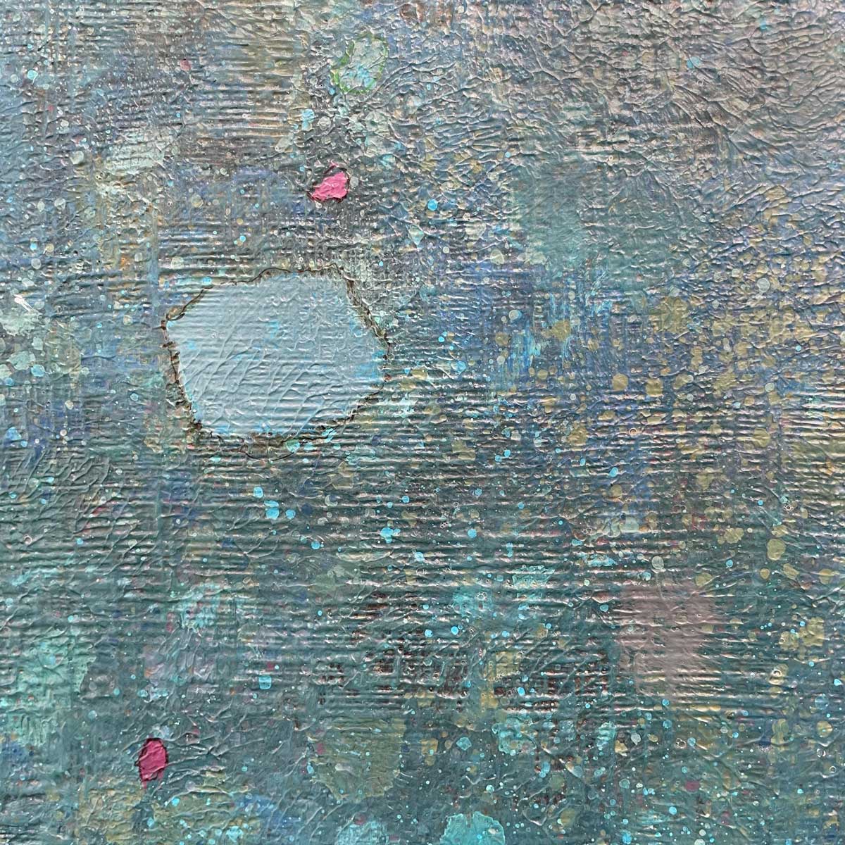 A up close detail of blue, sea-foam green and pink accents.