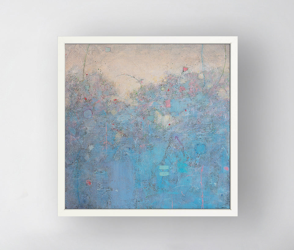 A blue abstract landscape in an unmatted white frame hangs on a white wall.