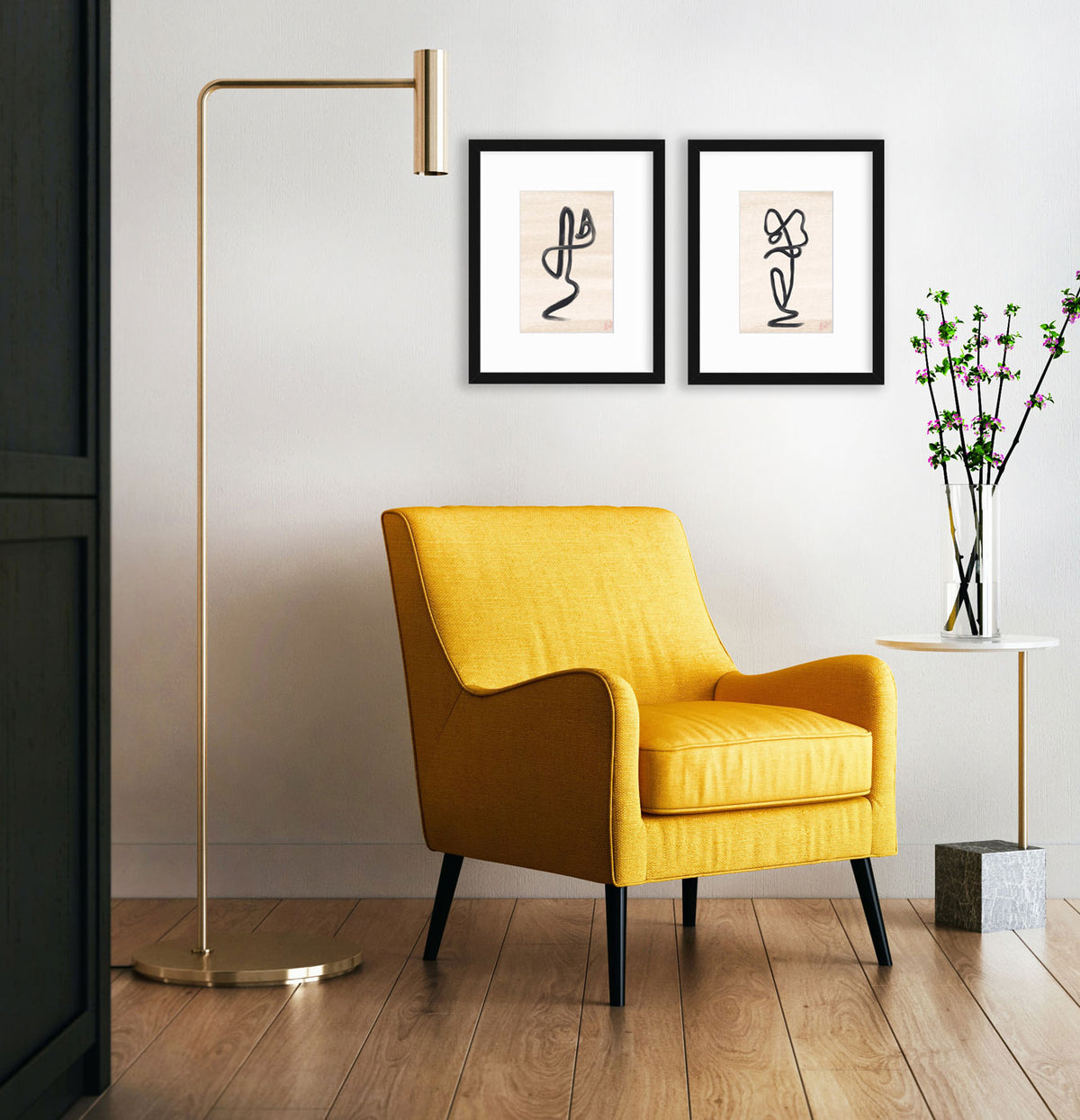 Two framed prints hang on a white wall above a yellow armchair, mid-century modern side table and floor lamp.