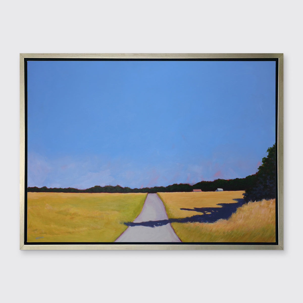 A A blue and yellow-green abstract landscape print, framed in a warm silver floater frame. 
