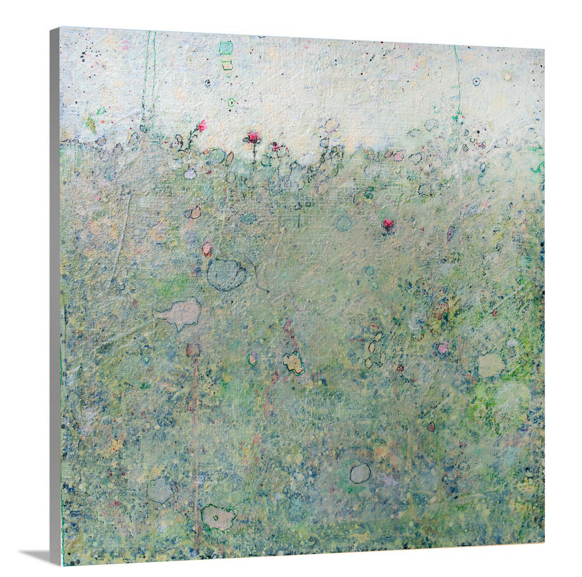 A side-angle view of a green abstract landscape print on canvas.