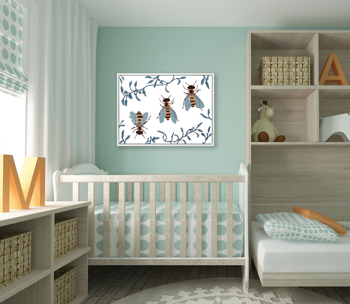 An illustration bee print hangs above a baby crib on a teal wall, between shelving and a curtained window. 