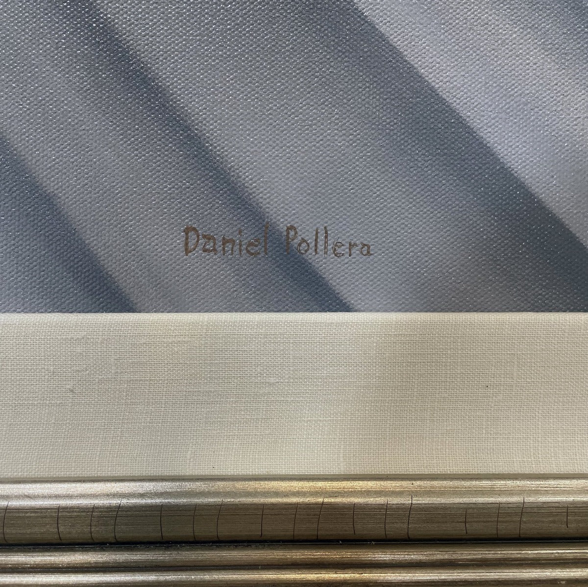 A close up of the artist's signature in the bottom right-hand corner of the painting.
