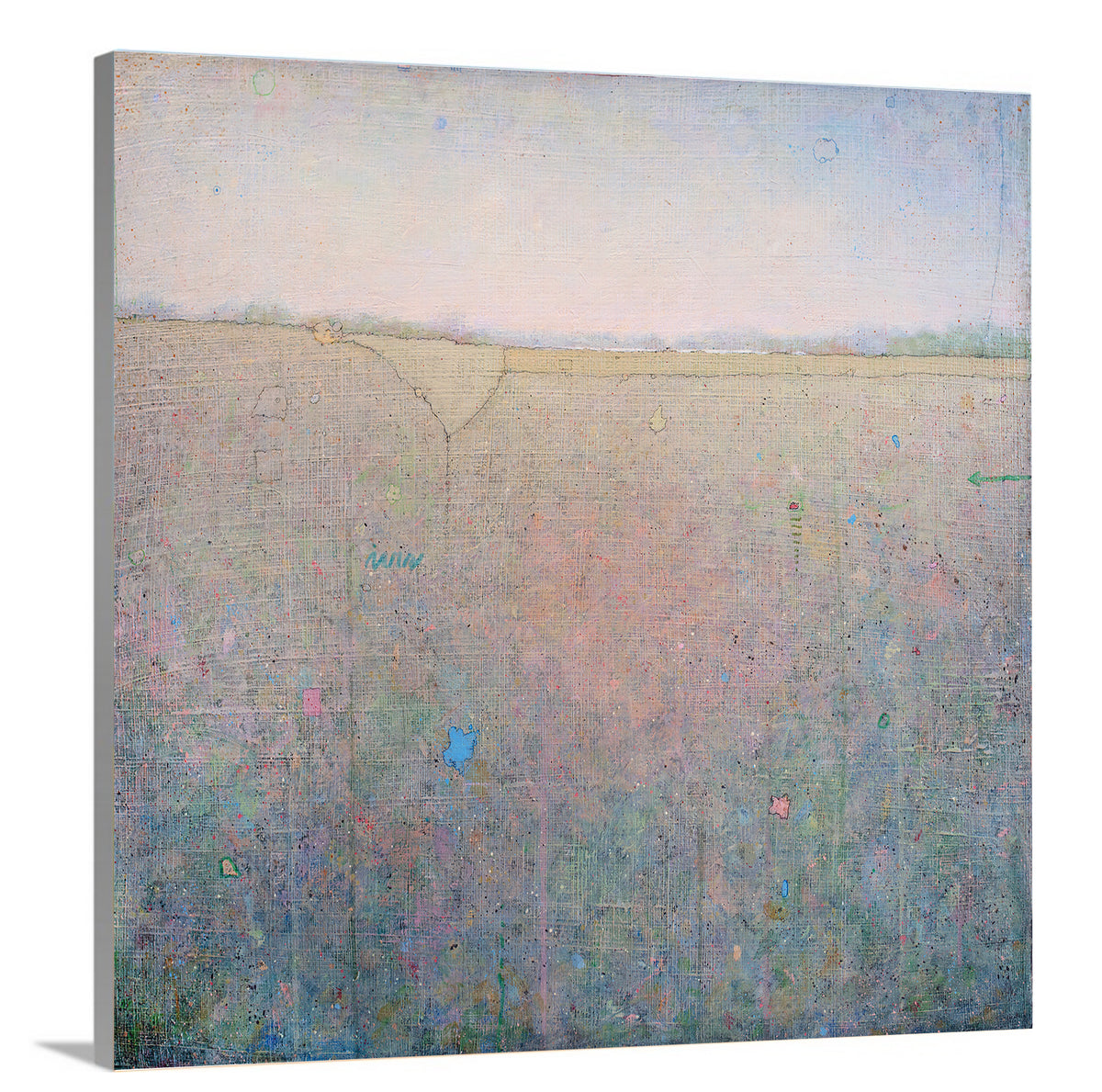 A side-angle view of a green, pink and blue abstract landscape print on canvas.