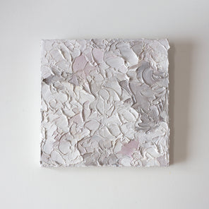 A light pink, white and warm grey impasto abstract painting. Hangs on a white gallery wall.